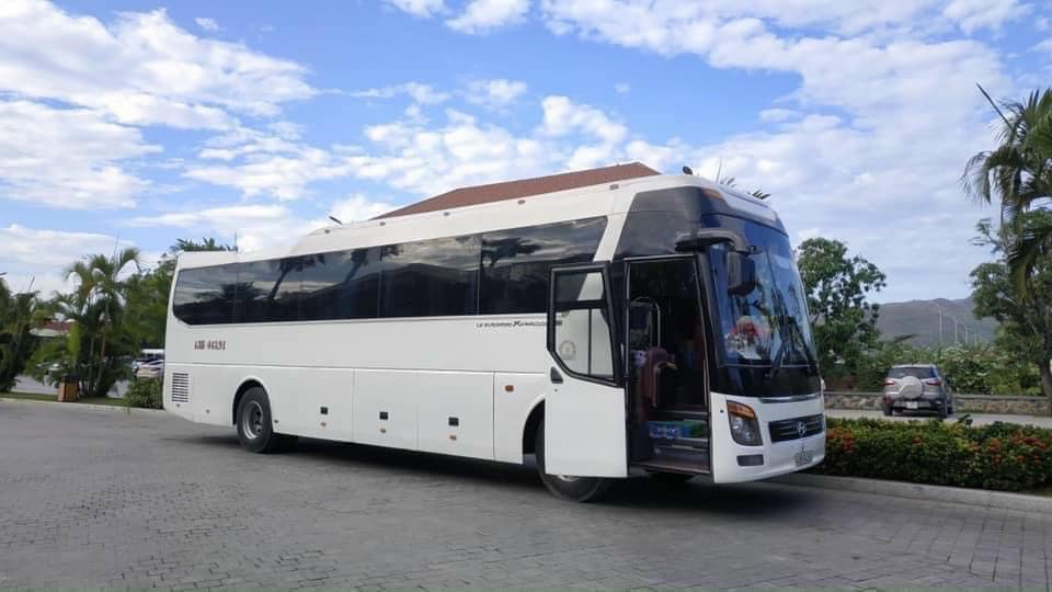 Phu Quoc Car Hire: Reliable & Affordable with KK2TRIP People standing next to a car and motorbike